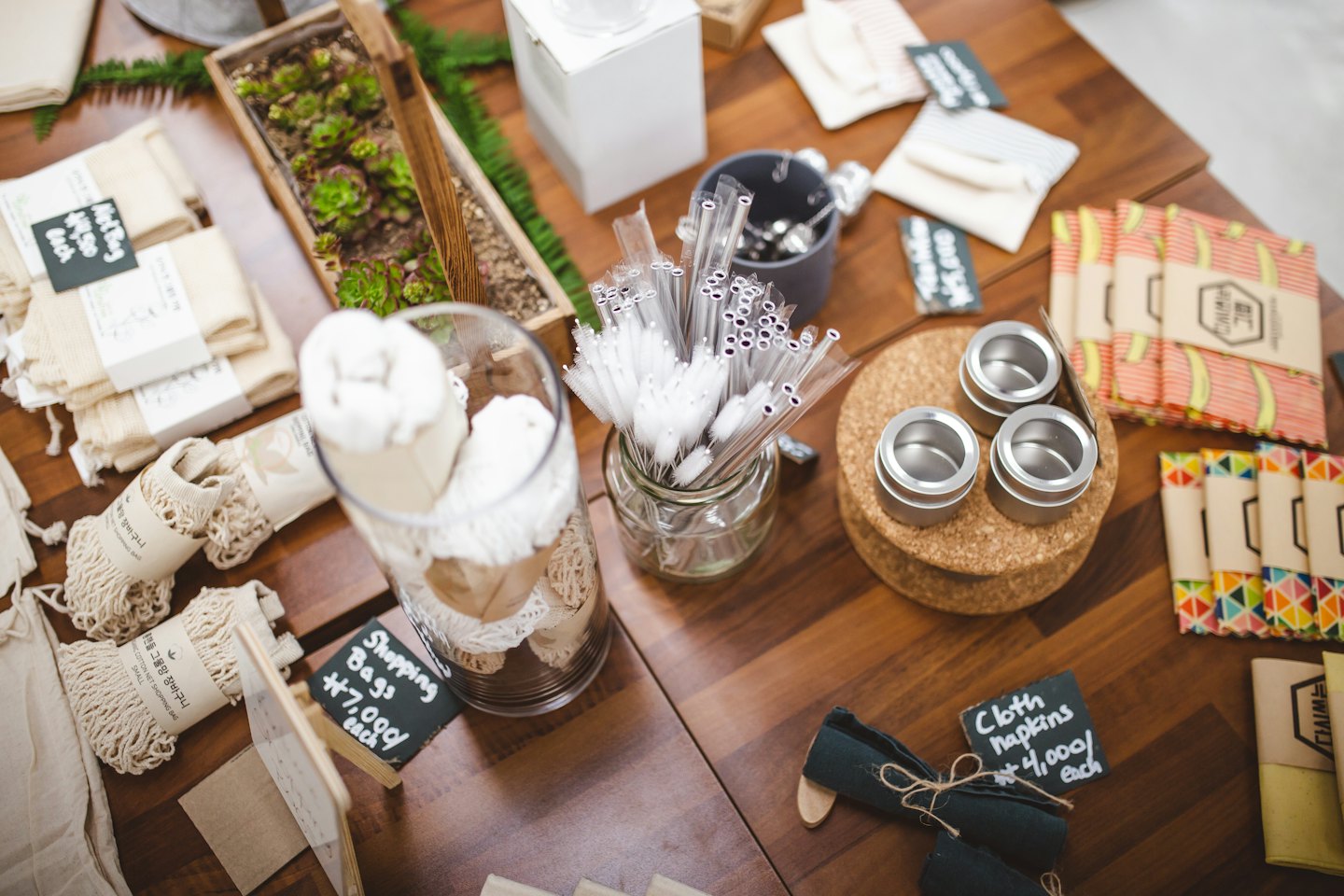 Eco-friendly retail products displayed on a wooden table.